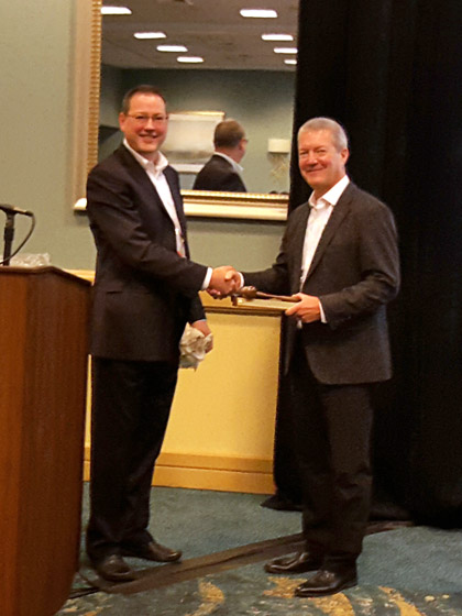 Eric Persson presents award to outgoing chair Ernie Parker
