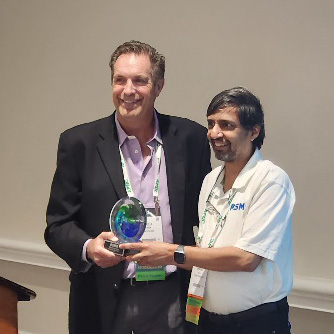 Dhaval Dalal receives his award for Outstanding Contributions