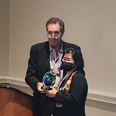 Ada Cheng receives her award for Outstanding Contributions